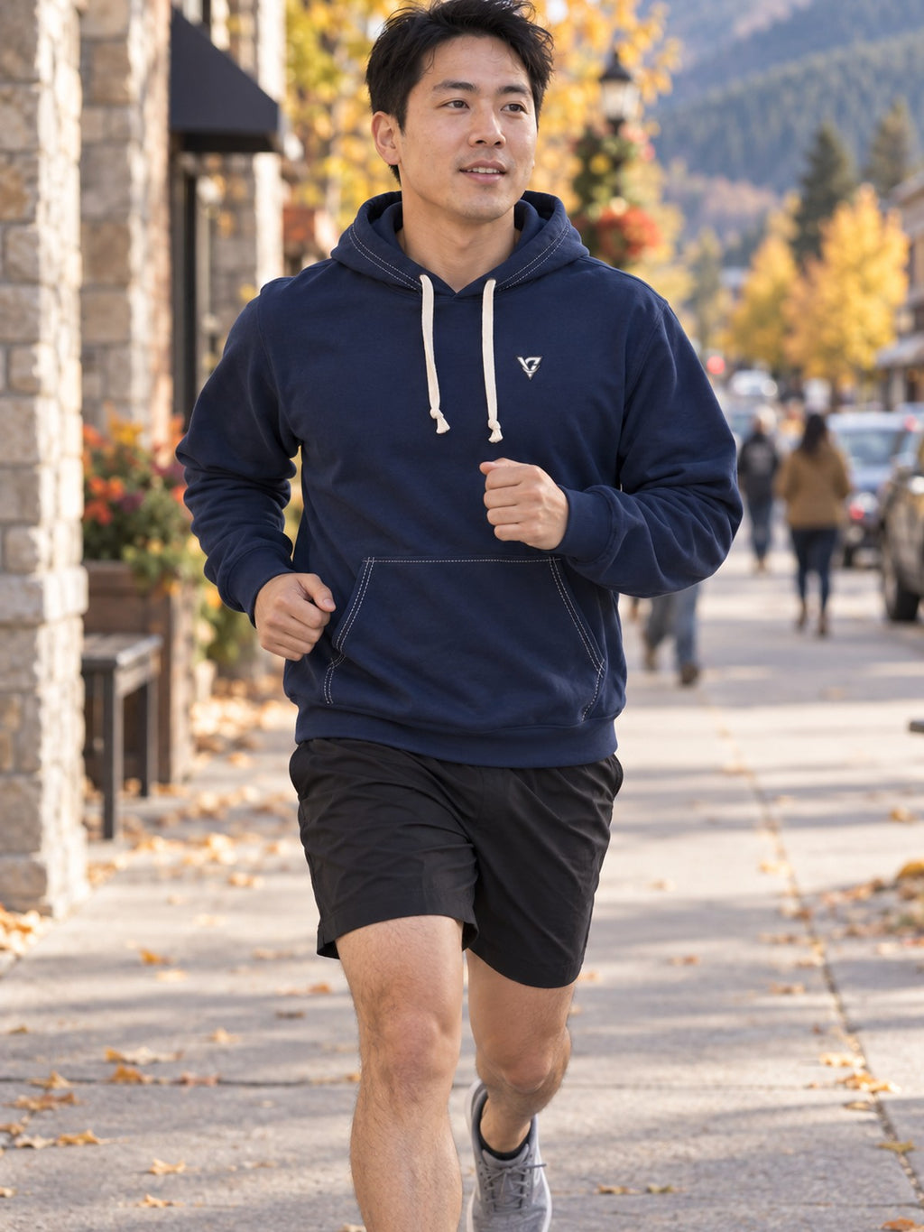 Man wearing the Midnight Navy Essential Men's Pullover Hoodie