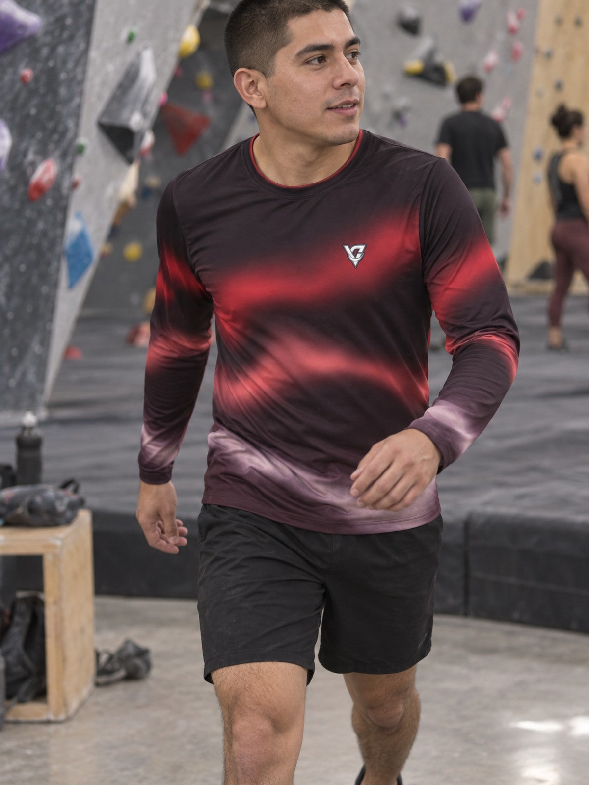 Man wearing the Crimson Aurora Men's Long Sleeve Athletic Shirt