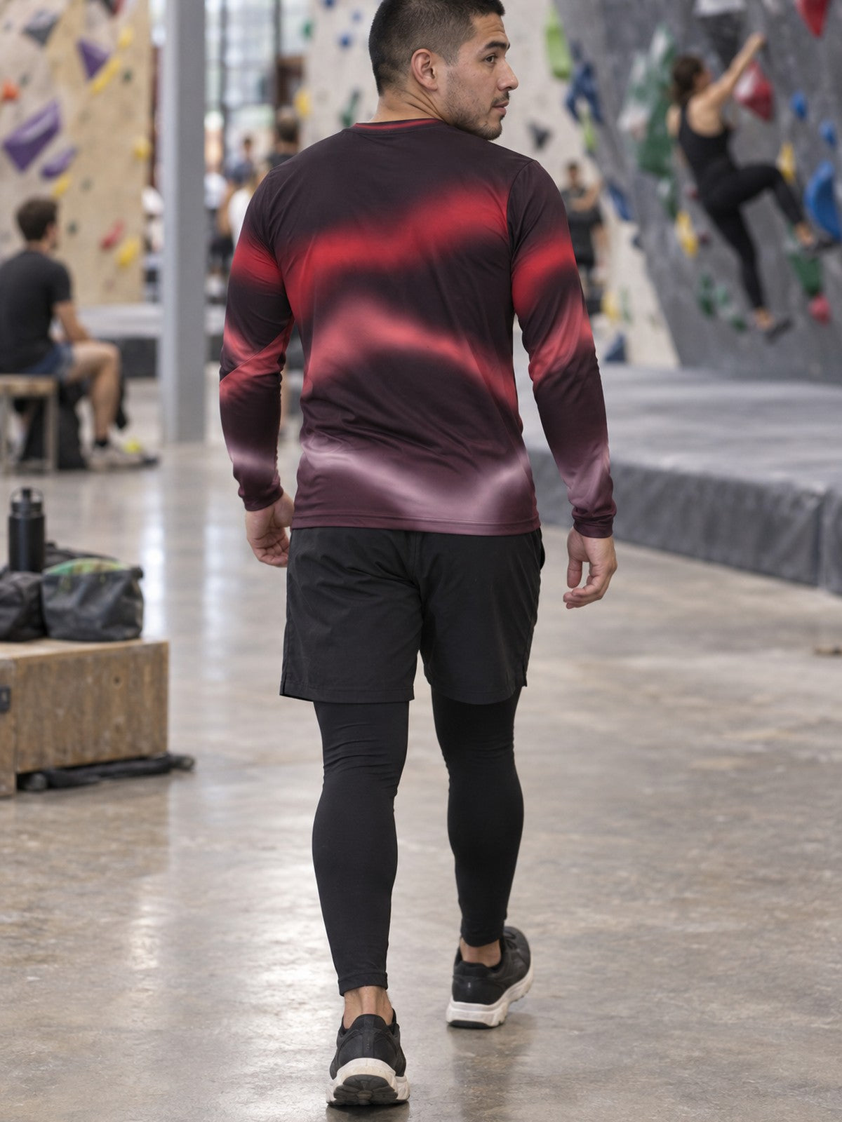 Man wearing the Crimson Aurora Men's Long Sleeve Athletic Shirt
