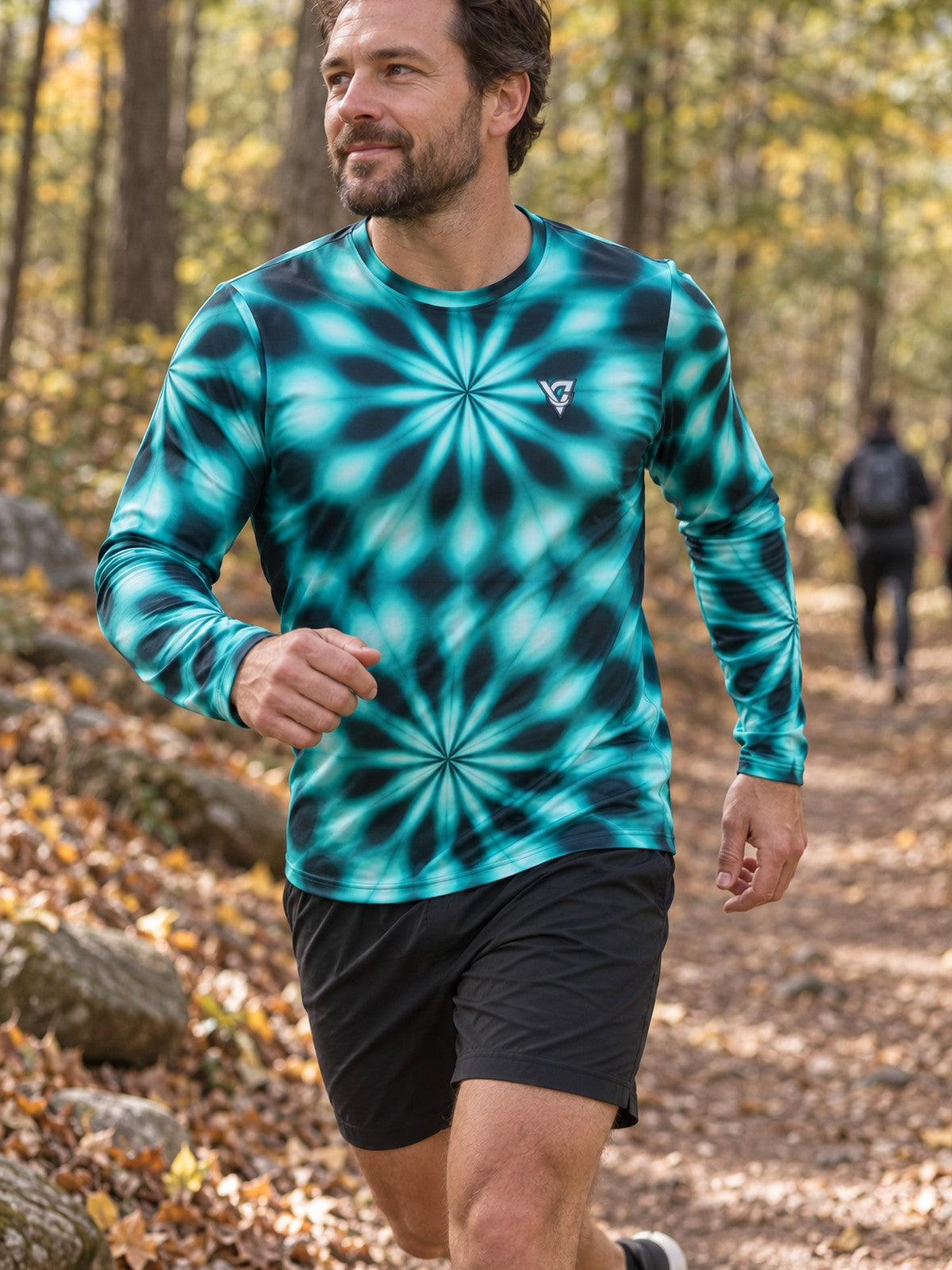 Man wearing the Teal Kaleidoscope Men's Long Sleeve Athletic Shirt