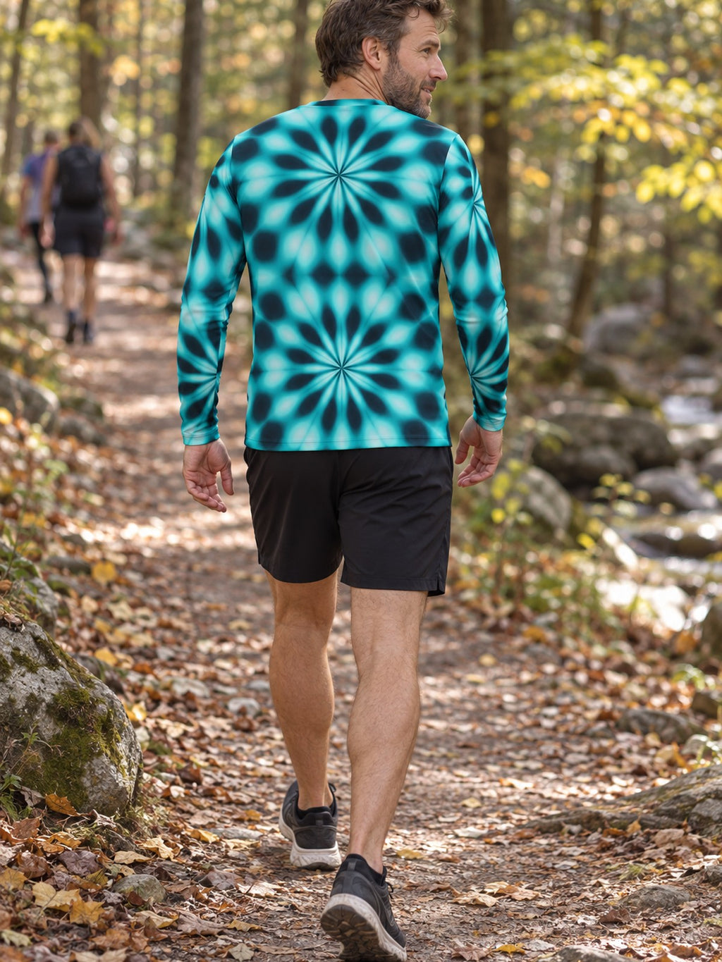 Man wearing the Teal Kaleidoscope Men's Long Sleeve Athletic Shirt