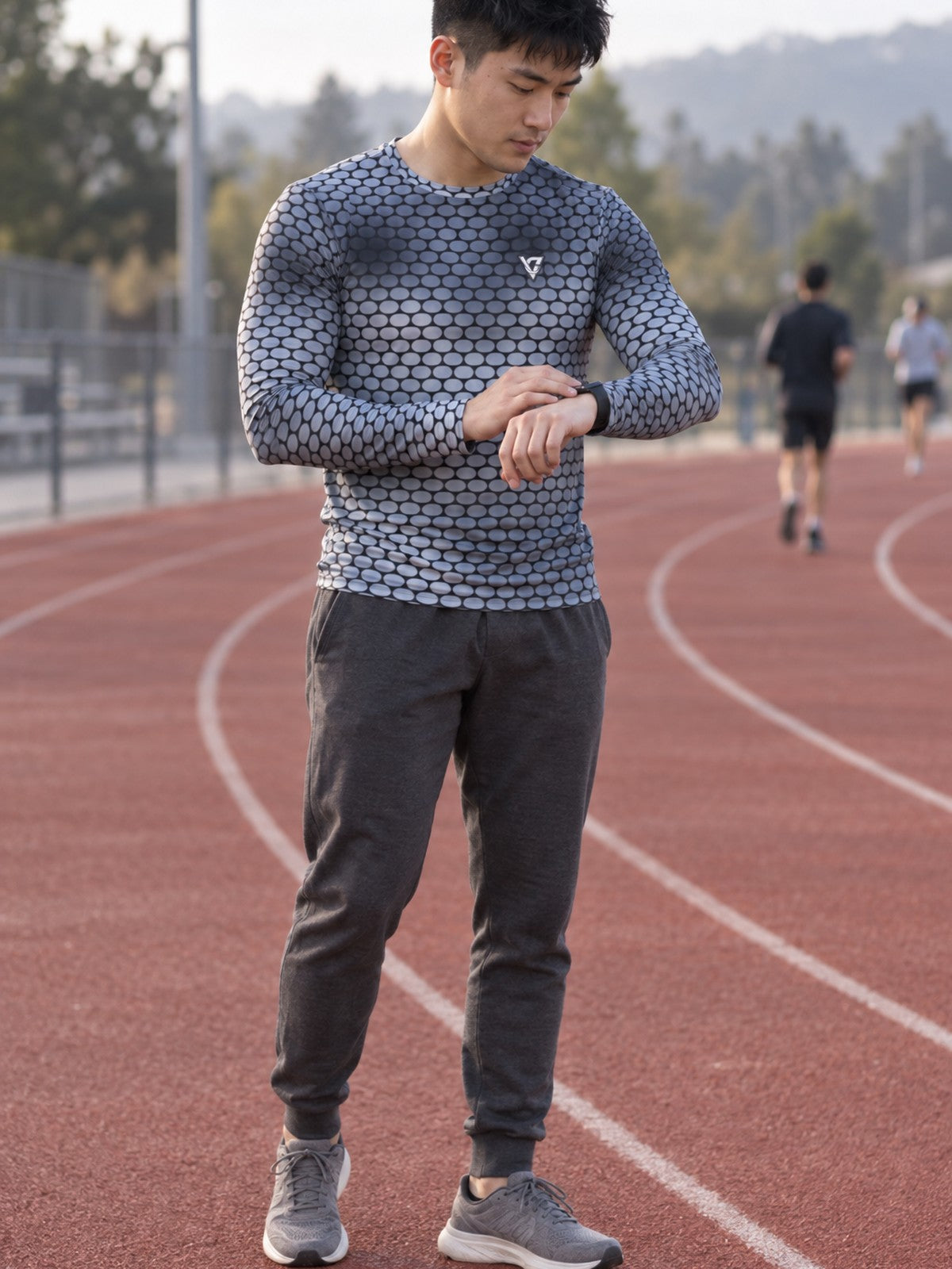 Man wearing the Steel Serpent Scale Men's Long Sleeve Athletic Shirt