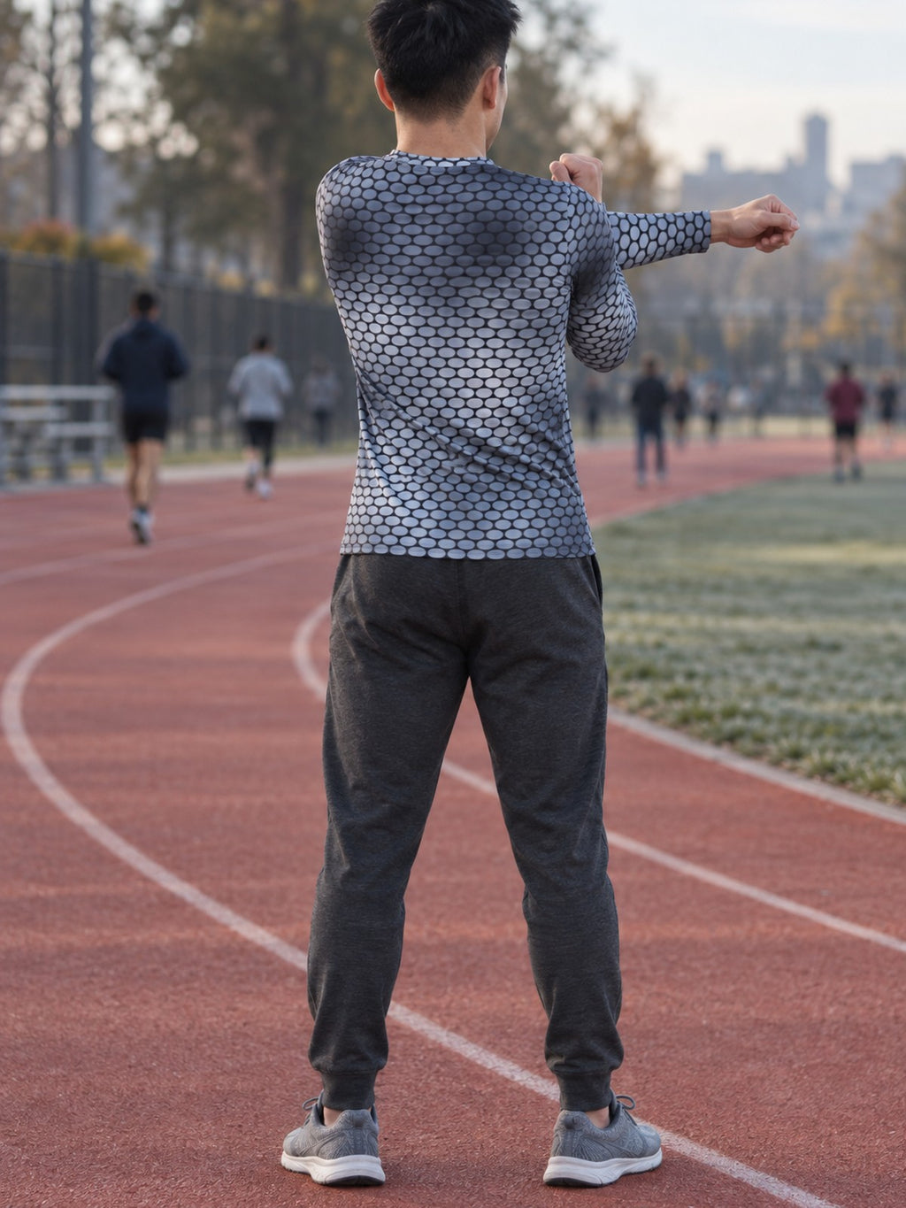 Man wearing the Steel Serpent Scale Men's Long Sleeve Athletic Shirt
