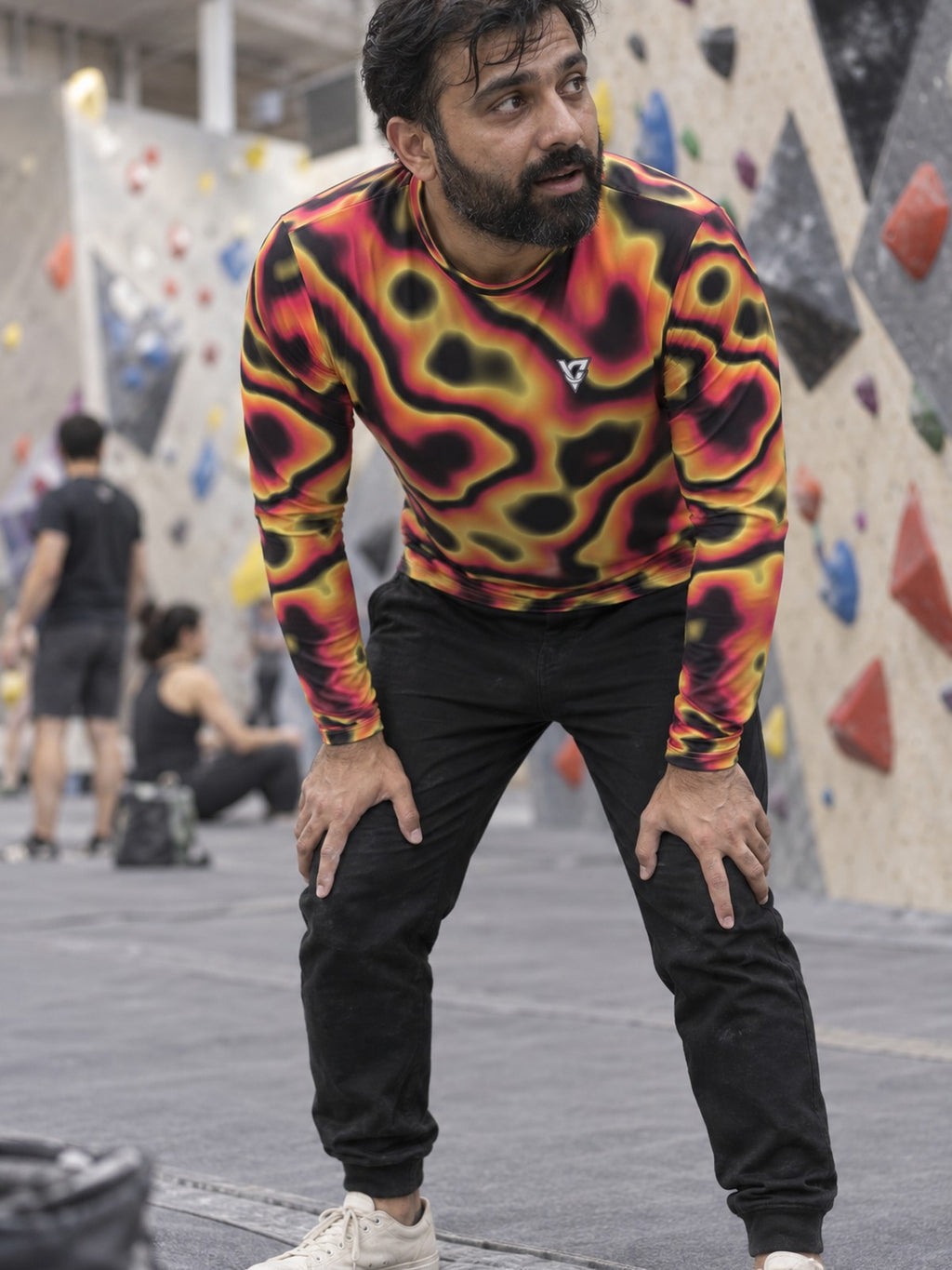 Man wearing the Inferno Oil Slick Men's Long Sleeve Athletic Shirt