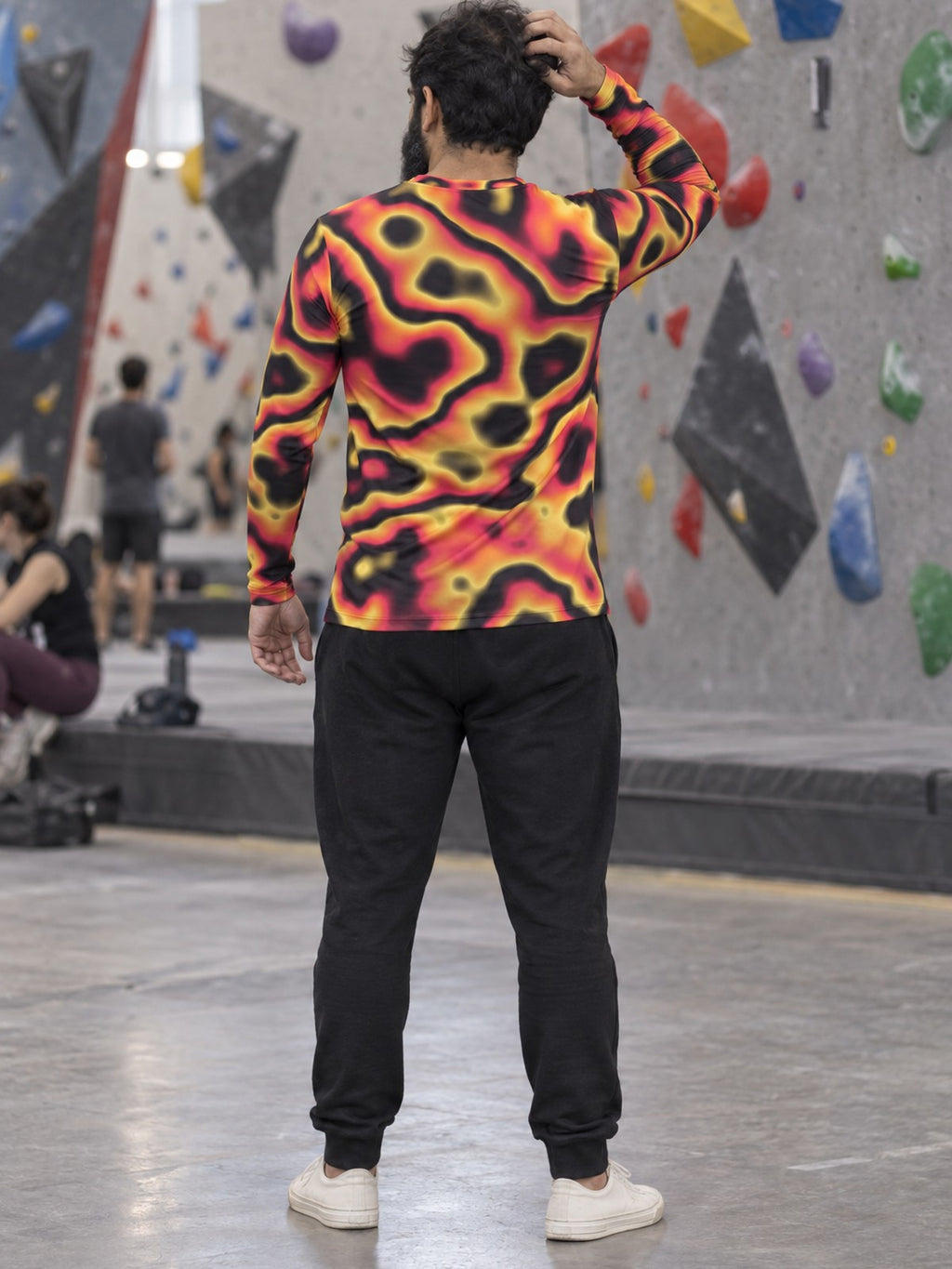 Man wearing the Inferno Oil Slick Men's Long Sleeve Athletic Shirt