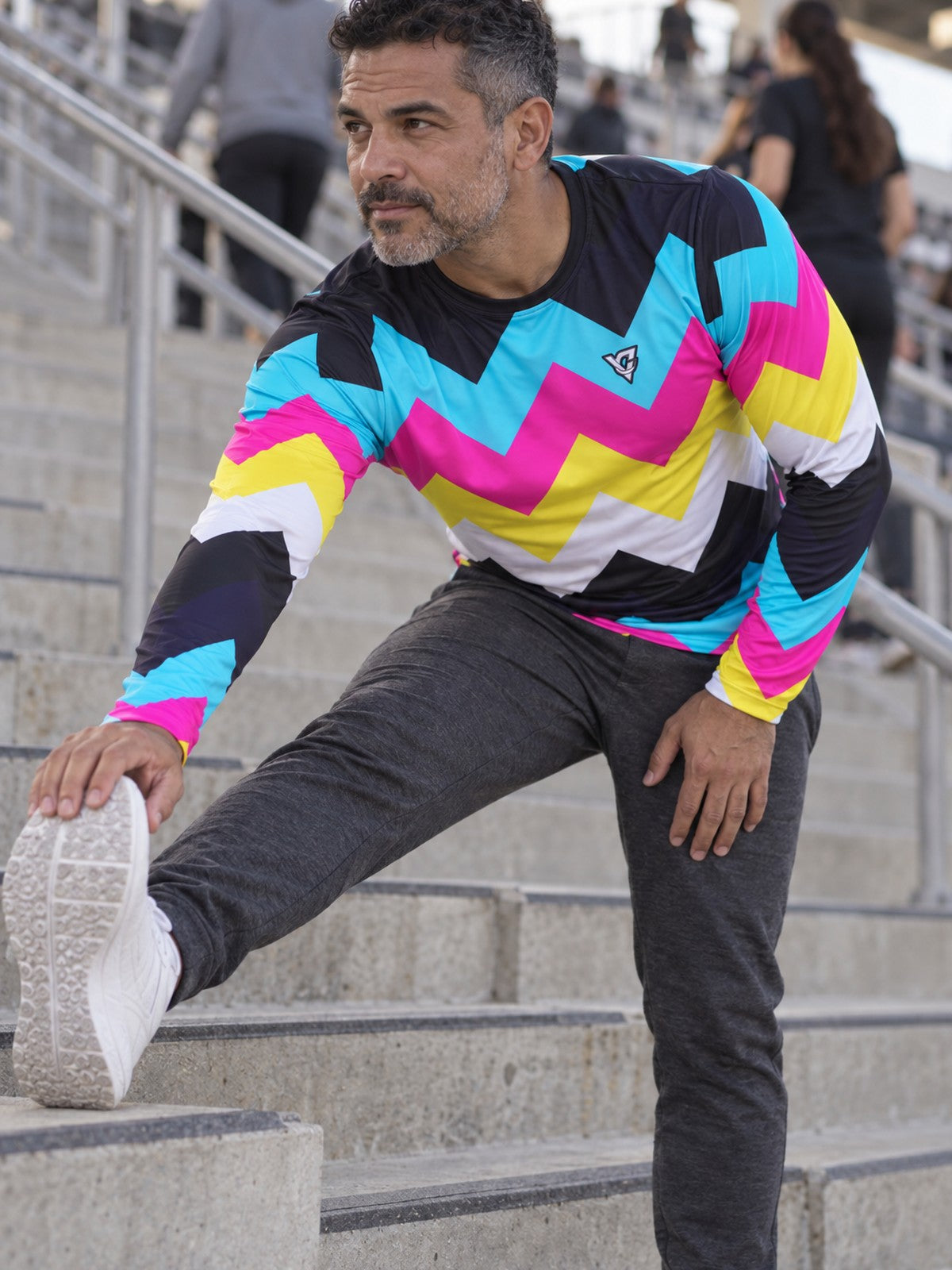 Man wearing the Neon Chevron Men's Long Sleeve Athletic Shirt