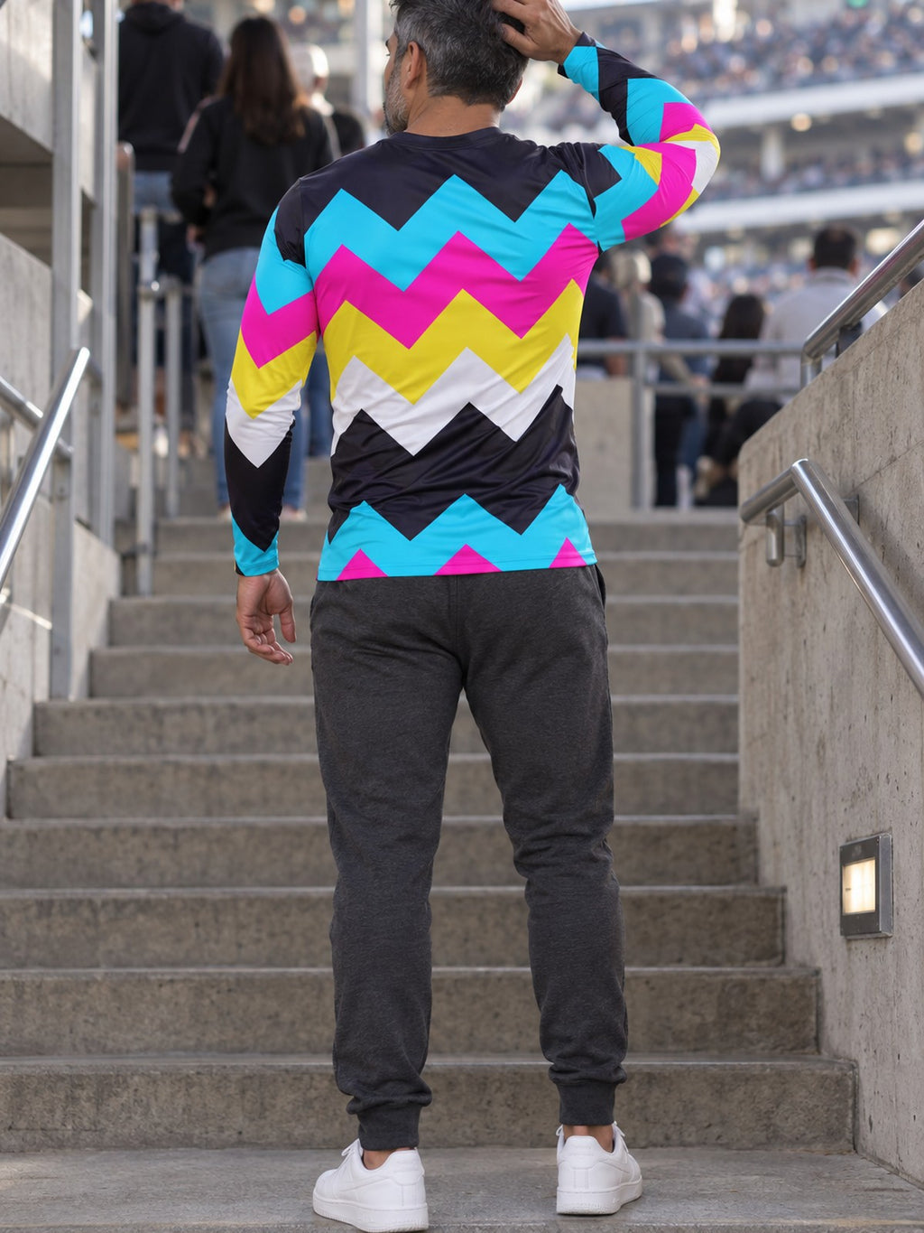 Man wearing the Neon Chevron Men's Long Sleeve Athletic Shirt