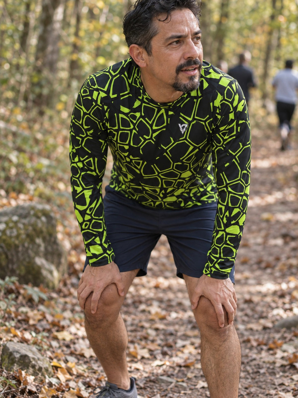 Man wearing the Volt Leopard Men's Long Sleeve Athletic Shirt