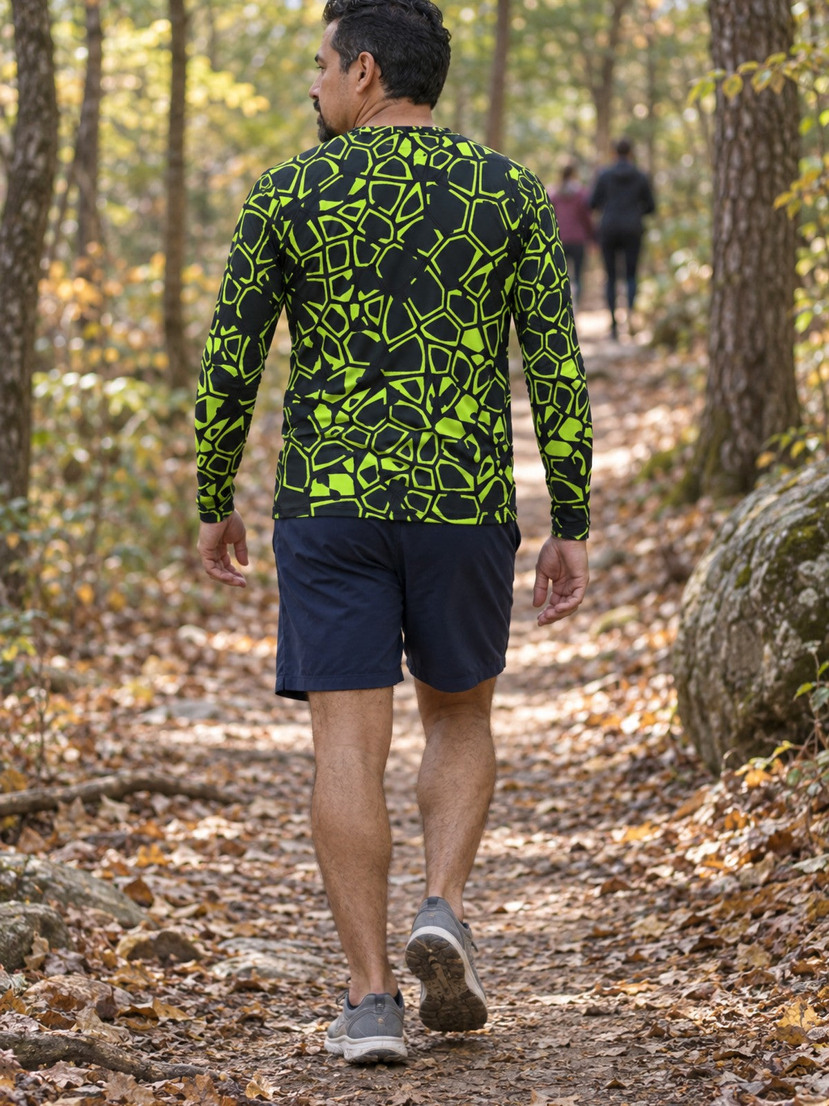 Man wearing the Volt Leopard Men's Long Sleeve Athletic Shirt
