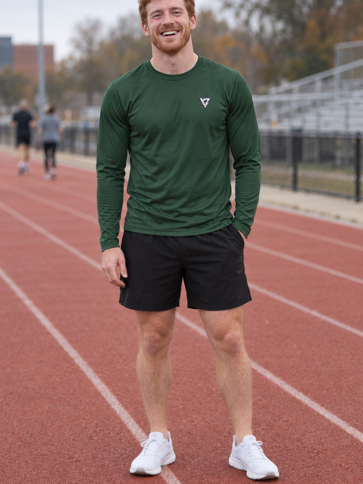 Man wearing the Forest Green Essential Men's Long Sleeve Athletic Shirt