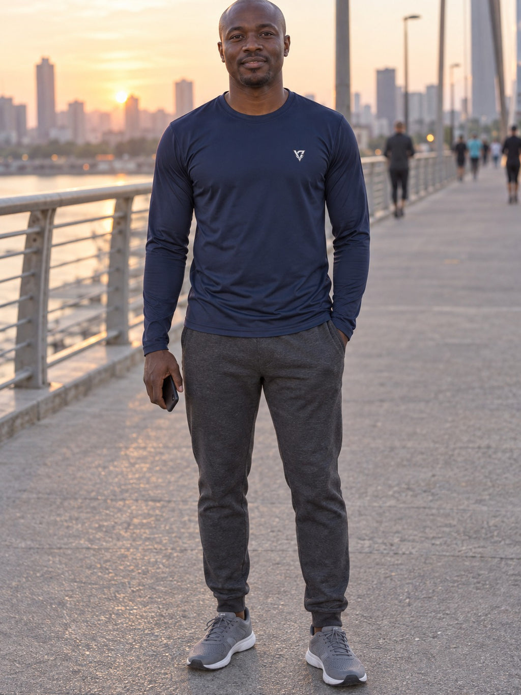Man wearing the Midnight Navy Essential Men's Long Sleeve Athletic Shirt