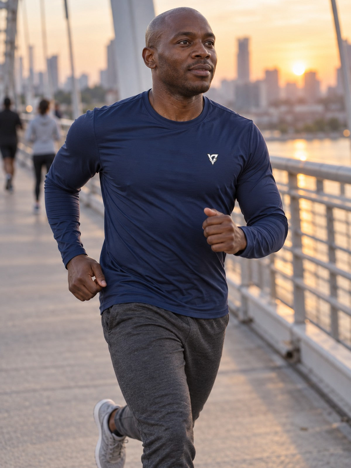 Man wearing the Midnight Navy Essential Men's Long Sleeve Athletic Shirt