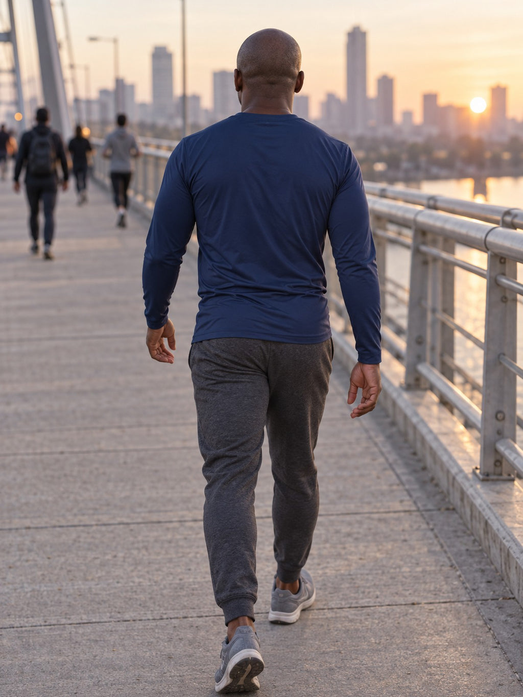 Man wearing the Midnight Navy Essential Men's Long Sleeve Athletic Shirt