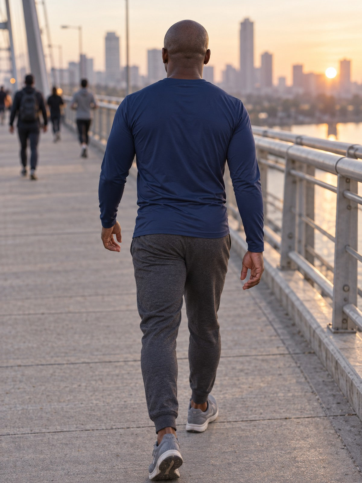 Man wearing the Midnight Navy Essential Men's Long Sleeve Athletic Shirt
