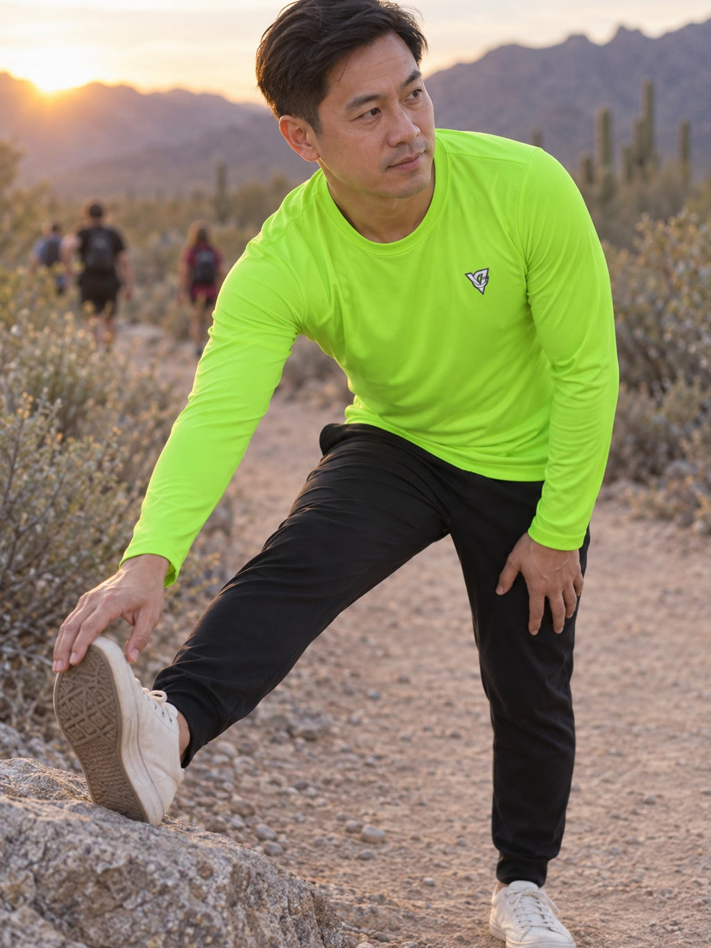 Man wearing the Volt Green Essential Men's Long Sleeve Athletic Shirt