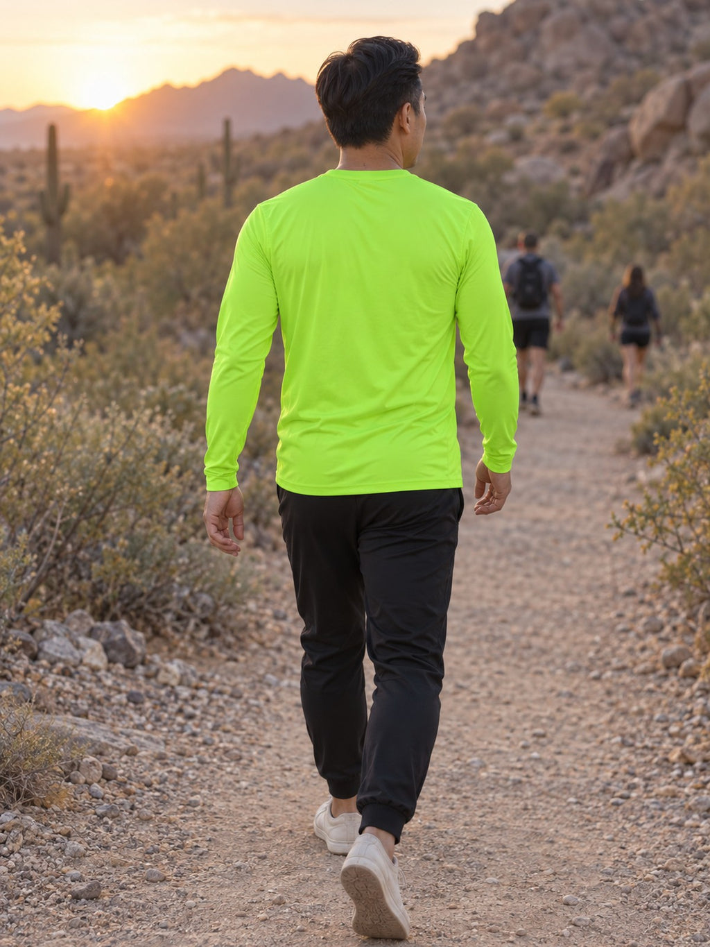 Man wearing the Volt Green Essential Men's Long Sleeve Athletic Shirt