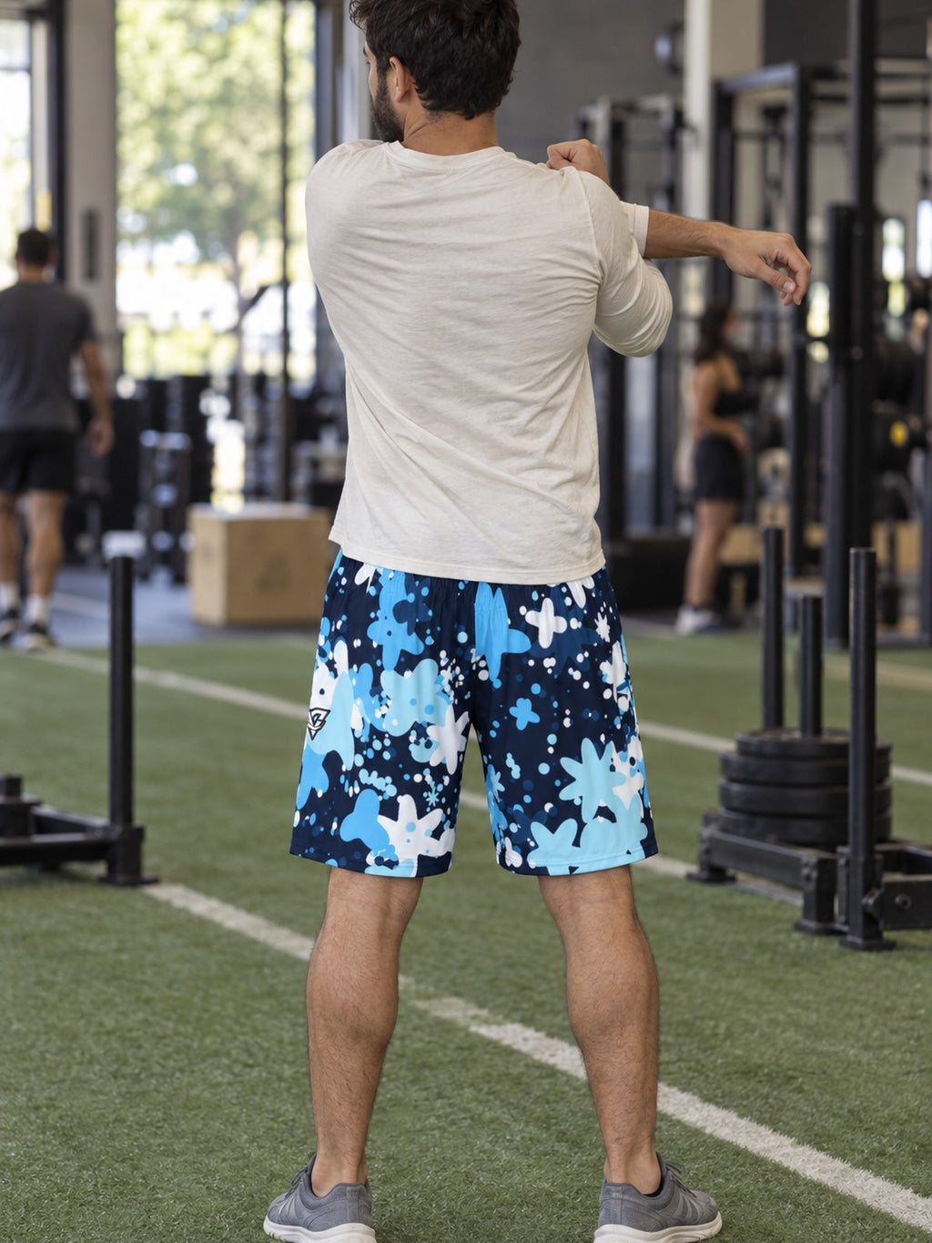 Man wearing the Men's Arctic Splatter Athletic Sports Shorts