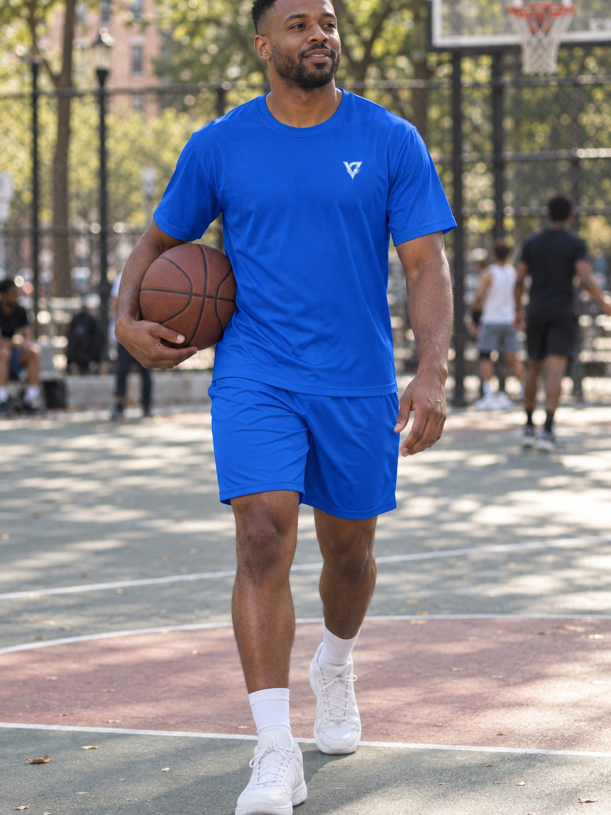 Man wearing the Royal Blue Essential men's matching set – athletic shirt and multipurpose shorts – front view
