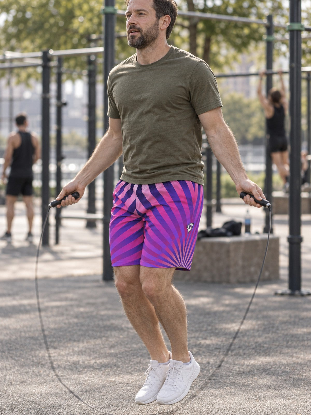 Man wearing the Men's Royal Sunburst Athletic Sports Shorts