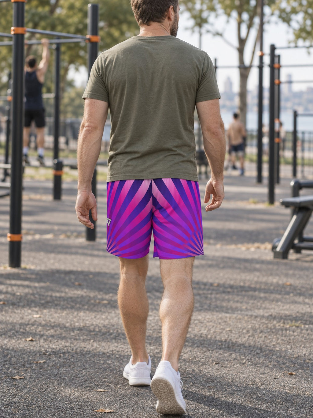 Man wearing the Men's Royal Sunburst Athletic Sports Shorts