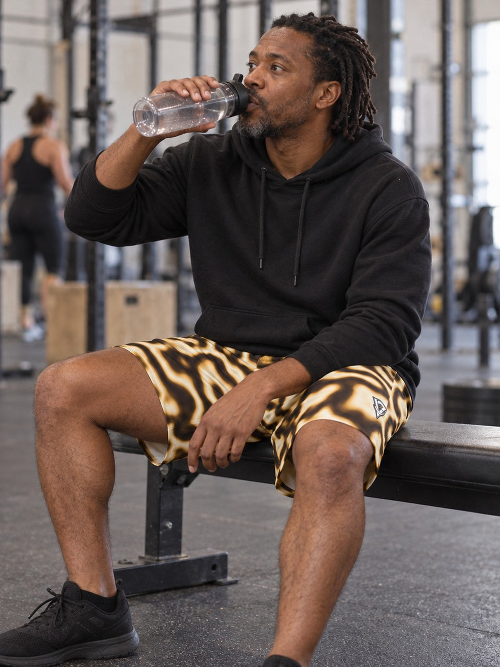 Man wearing the Men's Desert Marble Athletic Sports Shorts