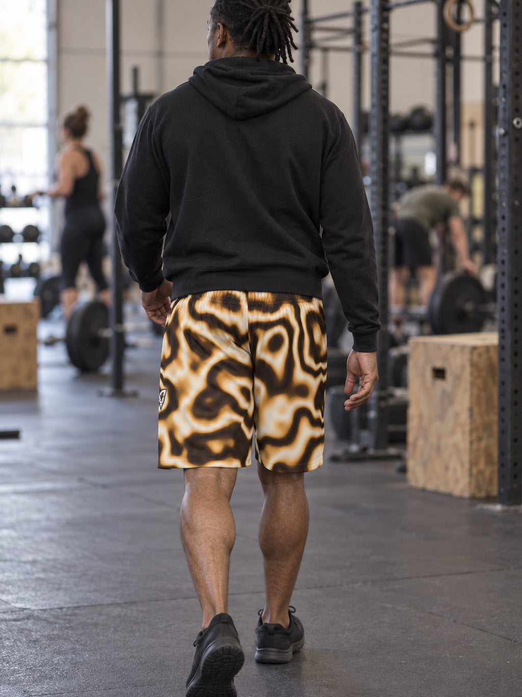 Man wearing the Men's Desert Marble Athletic Sports Shorts