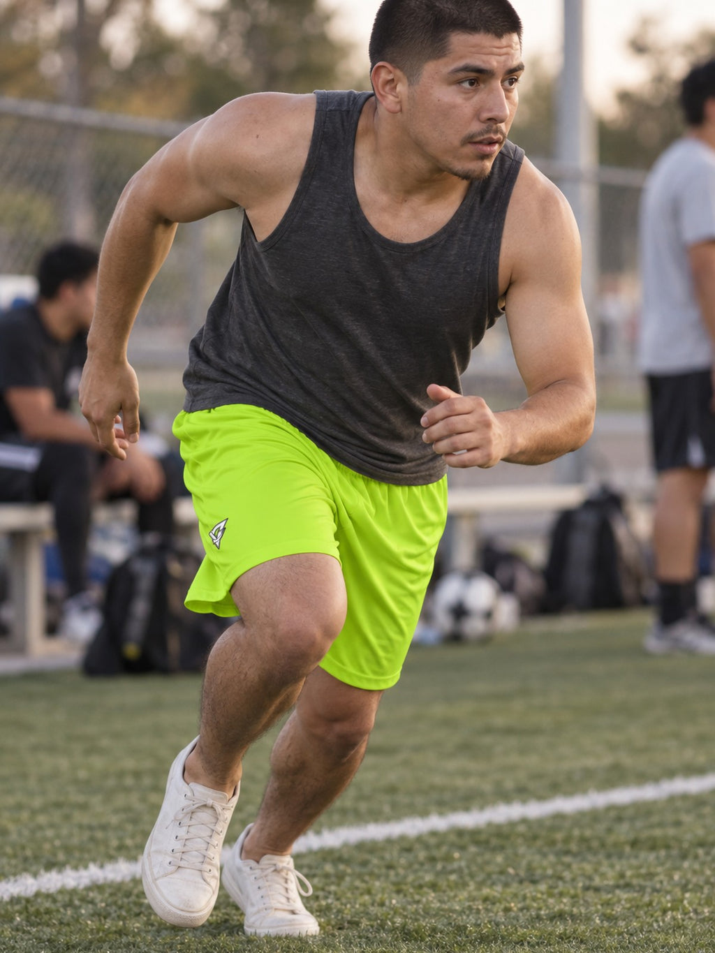 Man wearing the Men's Volt Green Essential Athletic Sports Shorts