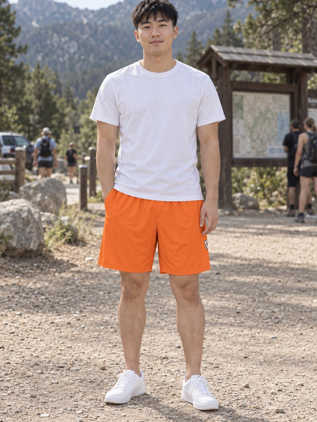 Man wearing the Men's Blaze Orange Essential Athletic Sports Shorts