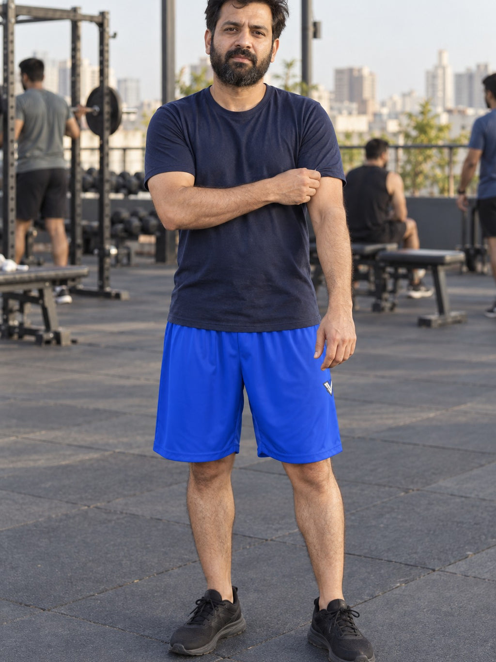 Man wearing the Men's Royal Blue Essential Athletic Sports Shorts