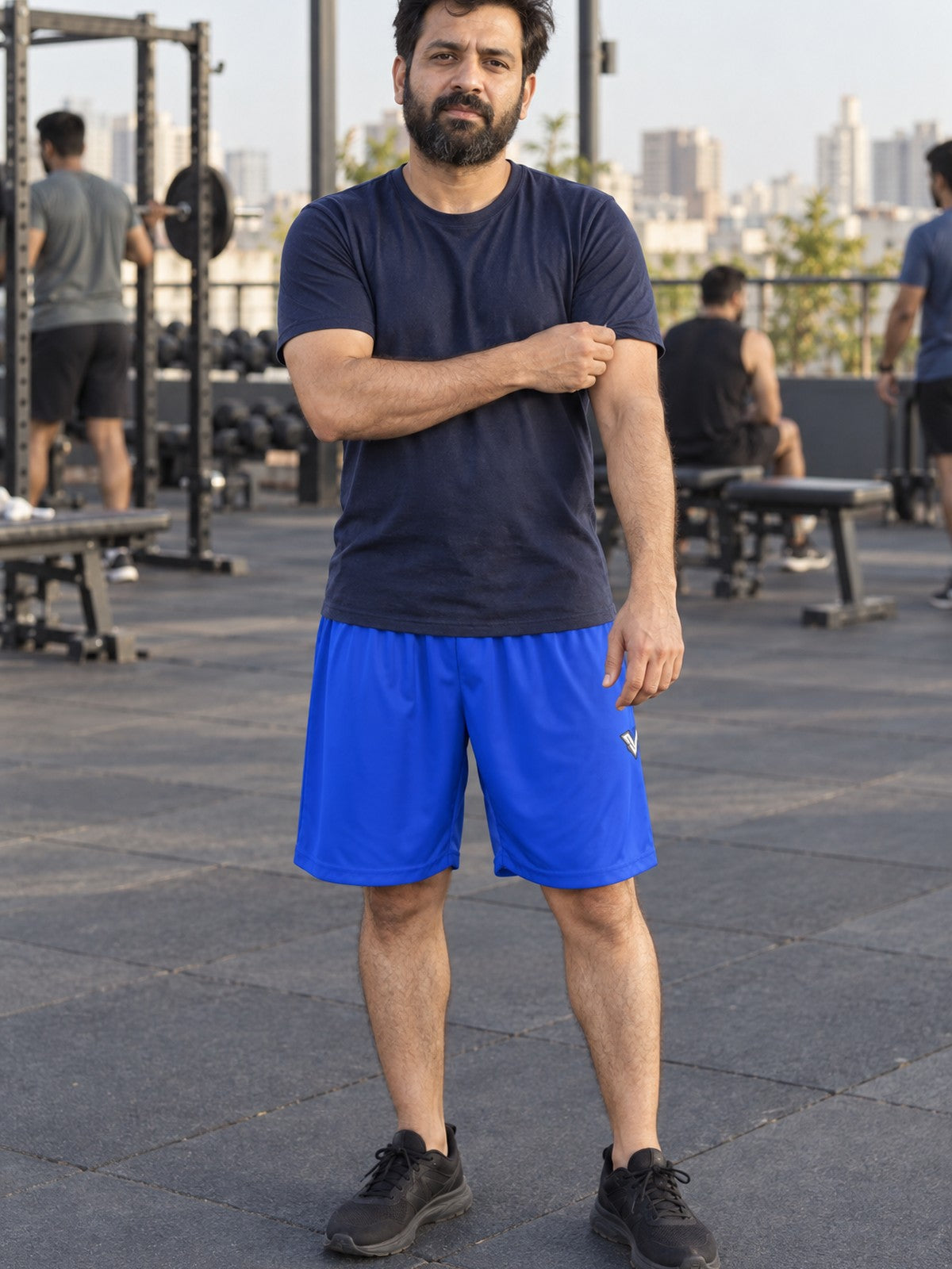 Man wearing the Men's Royal Blue Essential Athletic Sports Shorts