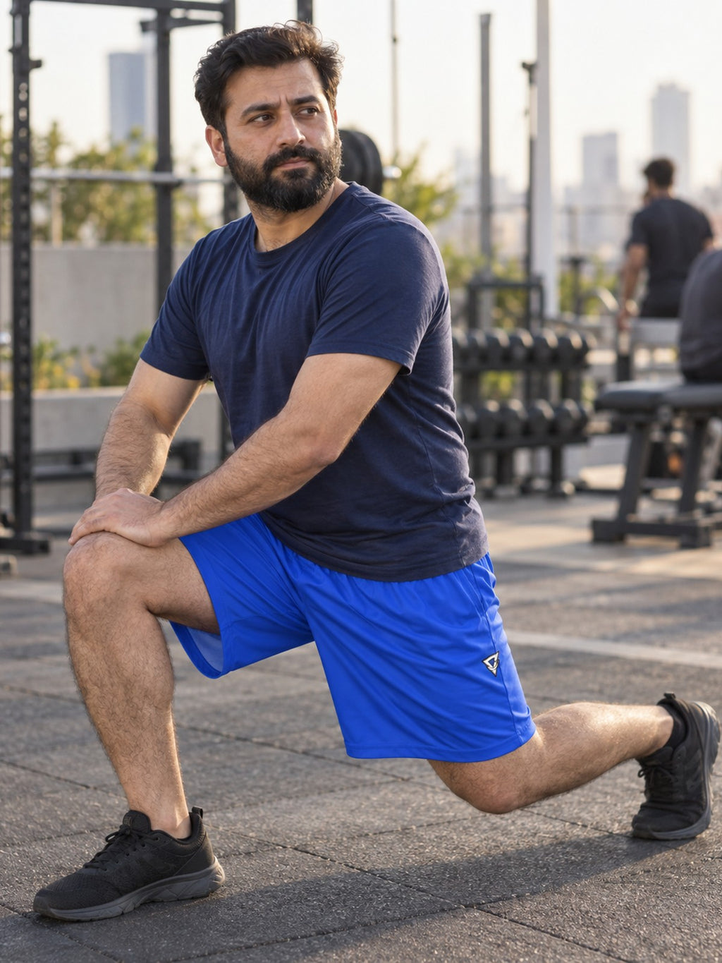 Man wearing the Men's Royal Blue Essential Athletic Sports Shorts