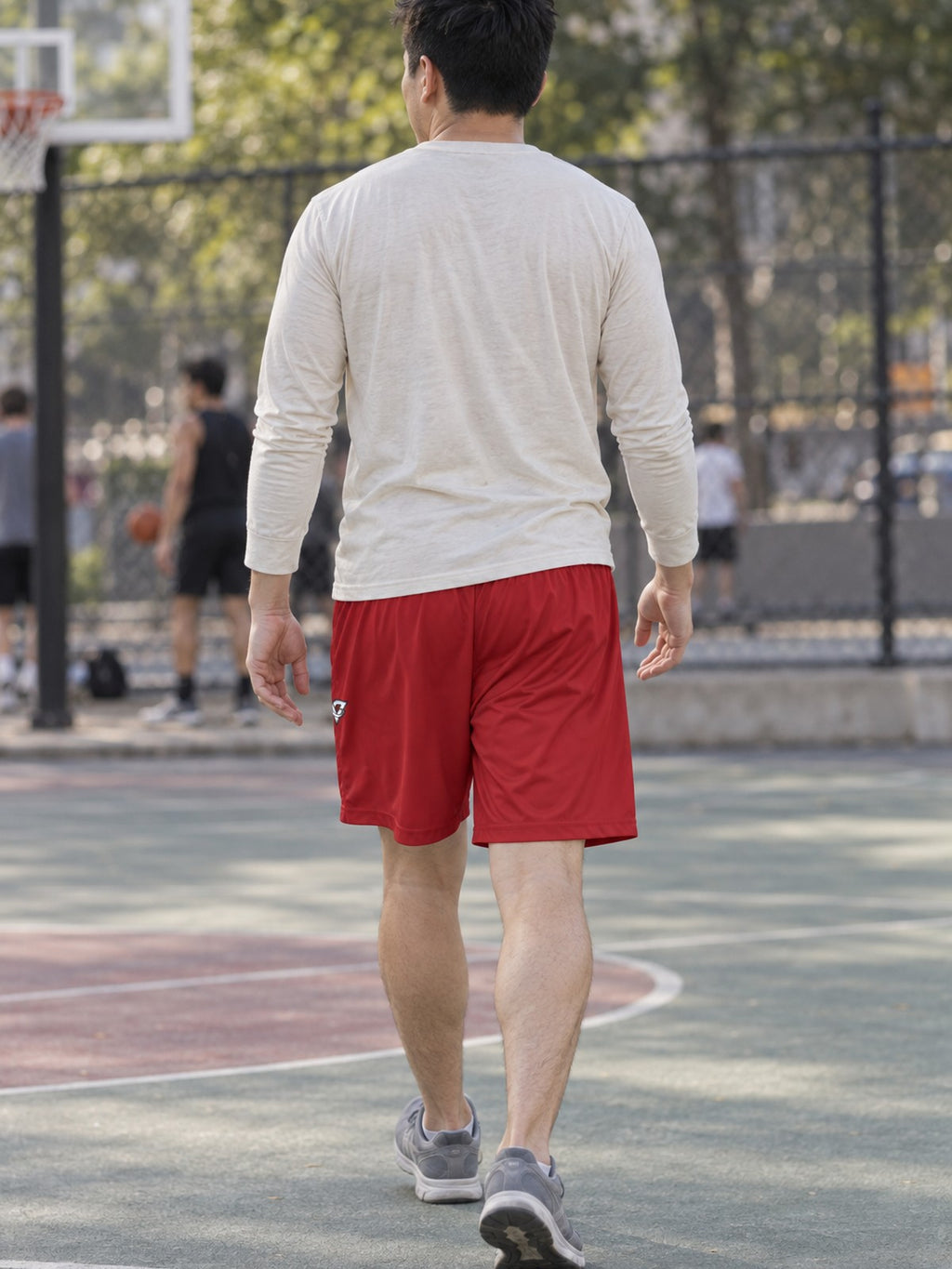 Man wearing the Men's Crimson Essential Athletic Sports Shorts