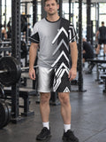 Man wearing the Monochrome Apex men's matching set – athletic shirt and multipurpose shorts – front view