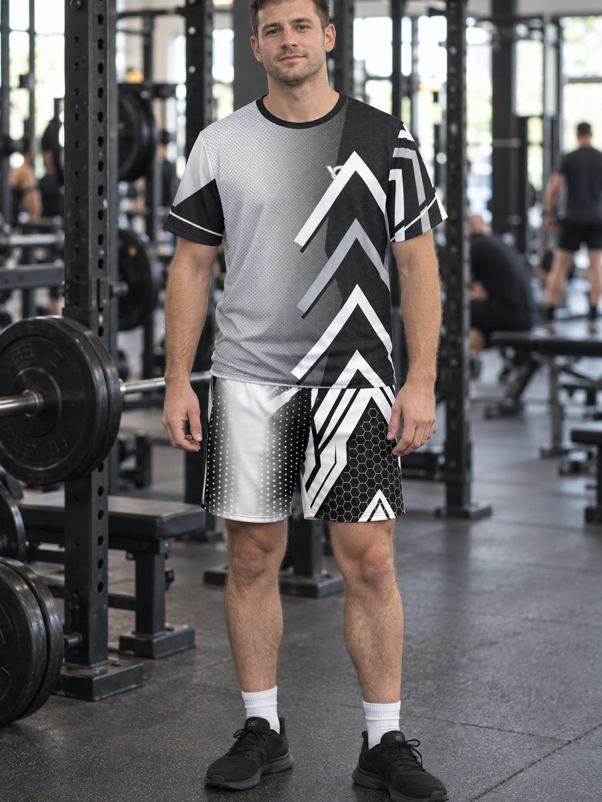 Man wearing the Monochrome Apex men's matching set – athletic shirt and multipurpose shorts – front view
