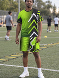 Man wearing the Volt Strike men's matching set – athletic shirt and multipurpose shorts – front view