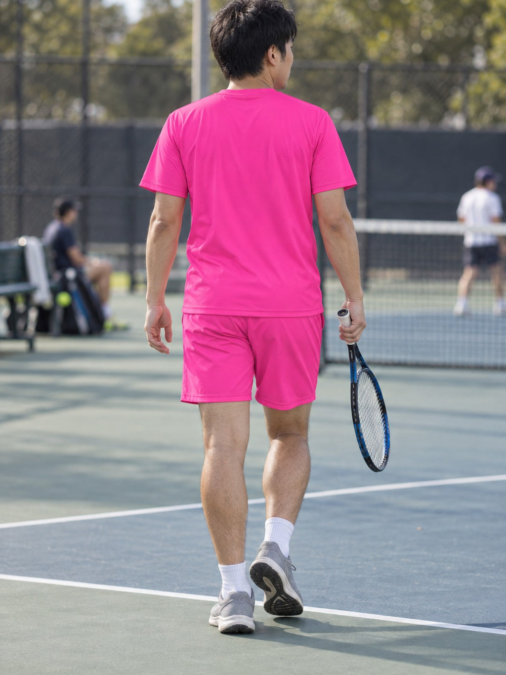 Man wearing the Electric Pink Essential men's matching set – back view