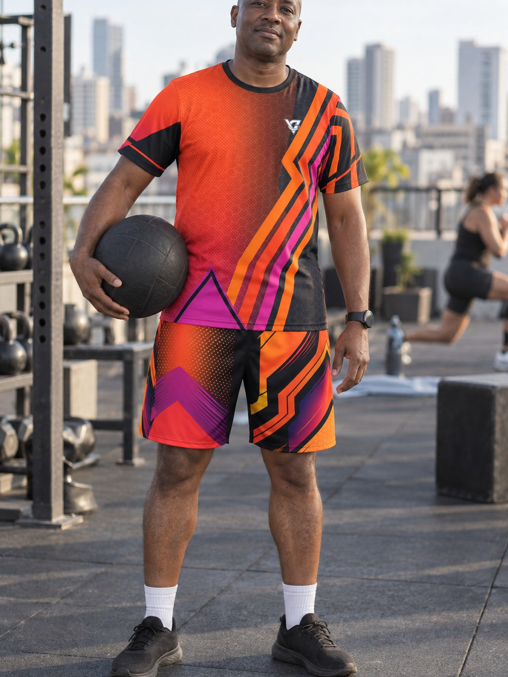 Man wearing the Sunset Fusion men's matching set – athletic shirt and multipurpose shorts – front view