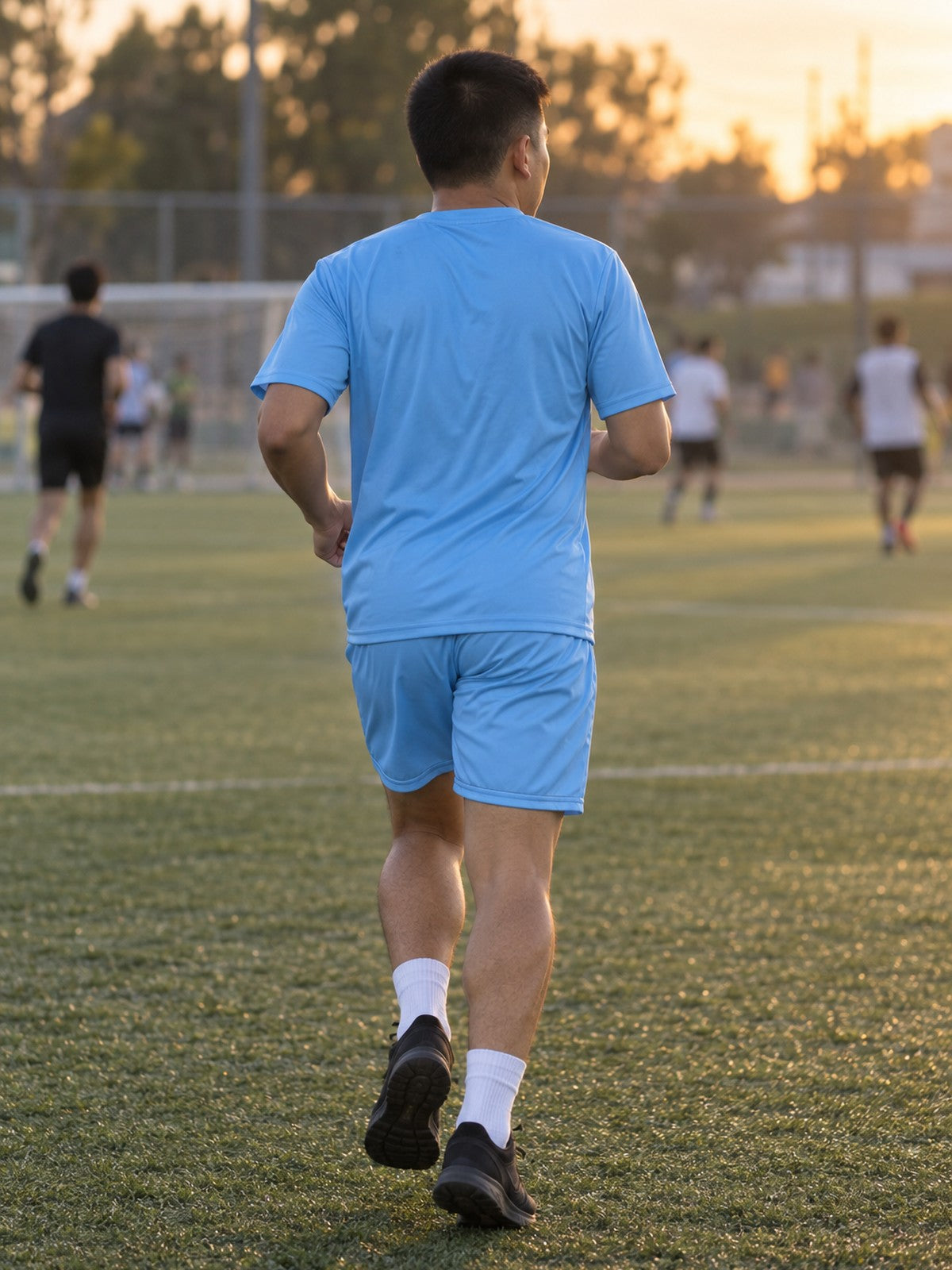 Man wearing the Sky Blue Essential men's matching set – back view