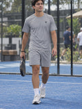 Man wearing the Stone Grey Essential men's matching set – athletic shirt and multipurpose shorts – front view
