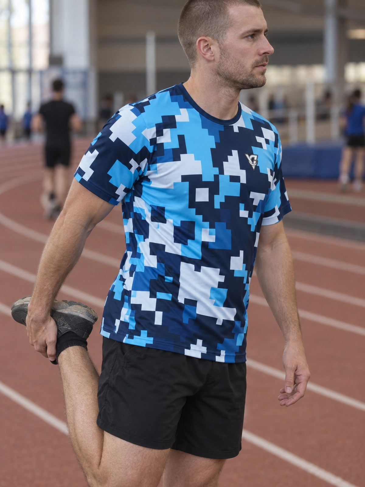 Man training in the Arctic Digital Camo men's sports jersey with the Vantacore V emblem on the left chest – side view