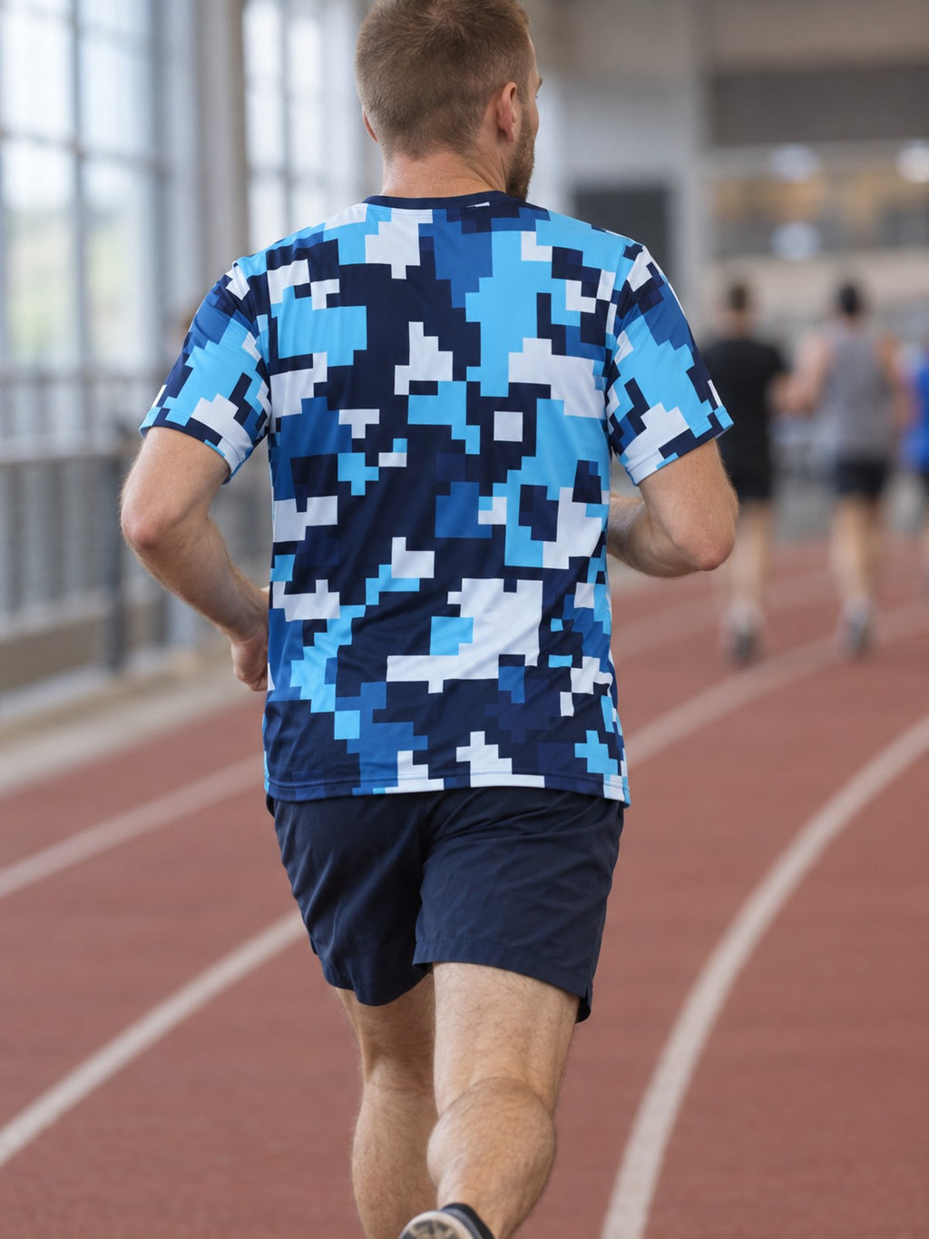 Man training in the Arctic Digital Camo men's sports jersey with the Vantacore V emblem on the left chest – back view