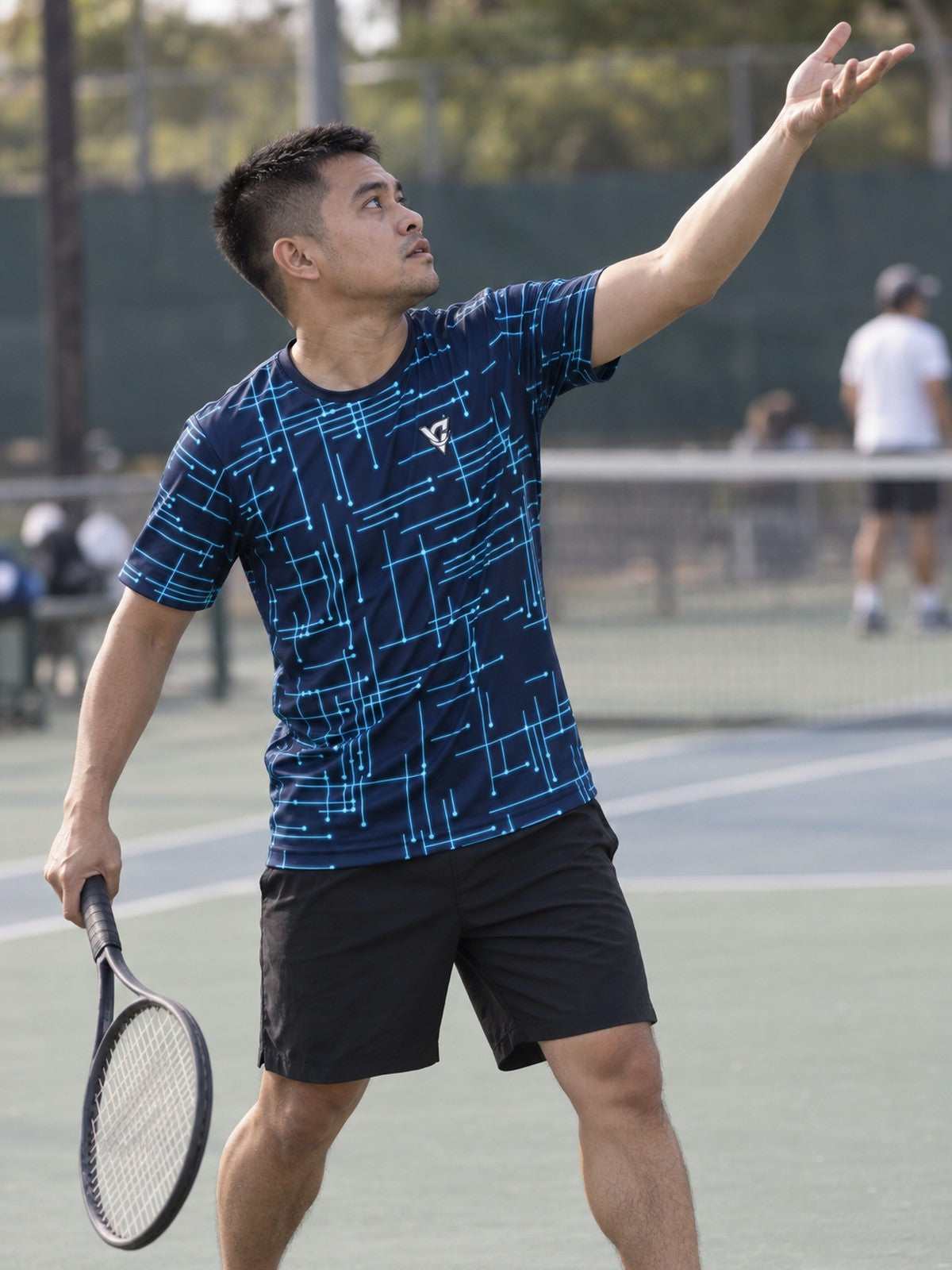 Man training in the Circuit Surge men's sports jersey with the Vantacore V emblem on the left chest – side view
