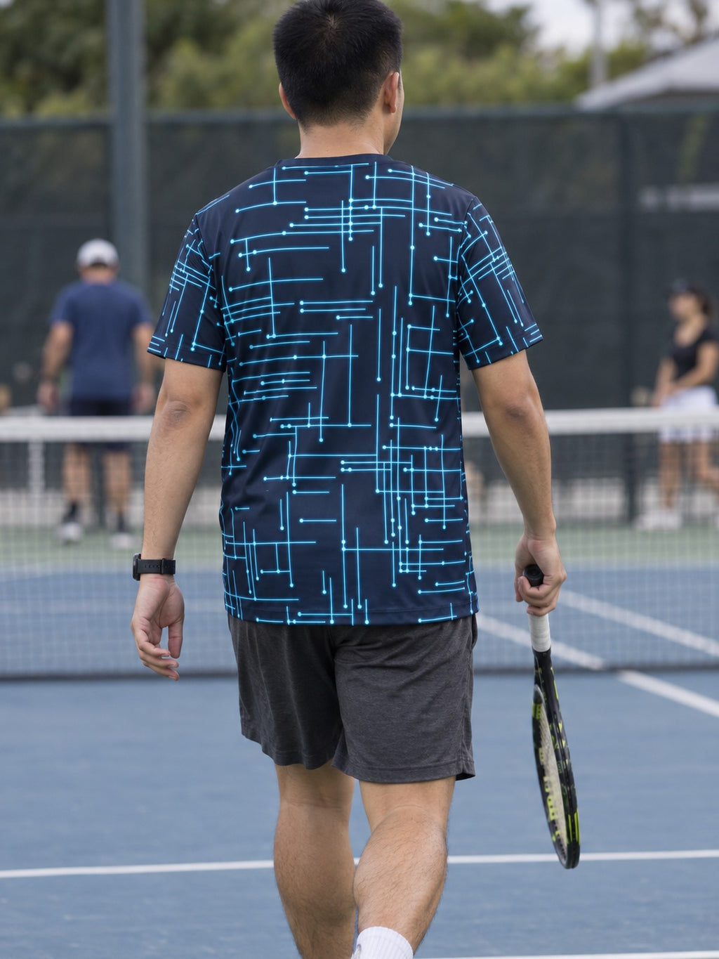 Man training in the Circuit Surge men's sports jersey with the Vantacore V emblem on the left chest – back view