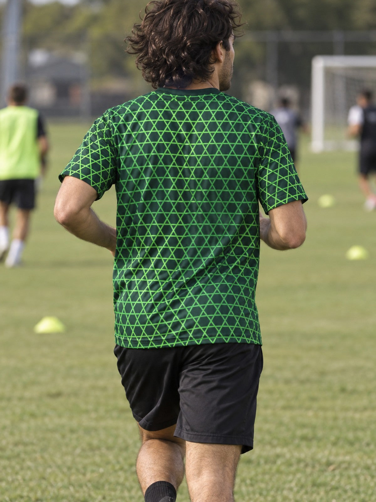 Man training in the Venom Hex men's sports jersey with the Vantacore V emblem on the left chest – back view