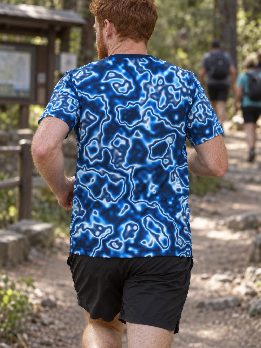 Man training in the Deep Ocean Marble men's sports jersey with the Vantacore V emblem on the left chest – back view