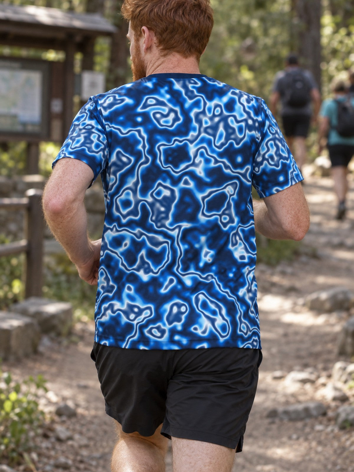 Man training in the Deep Ocean Marble men's sports jersey with the Vantacore V emblem on the left chest – back view