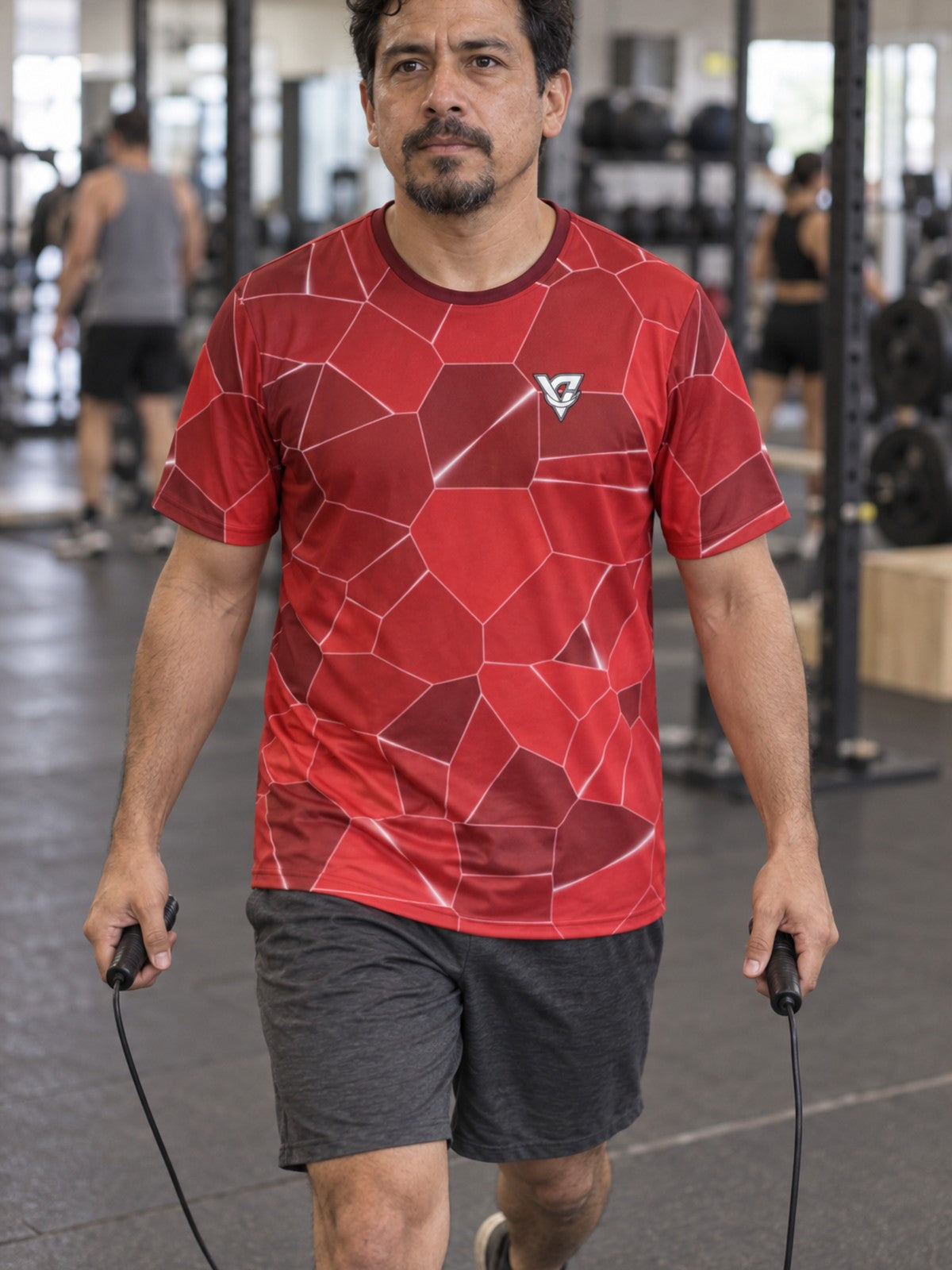 Man training in the Crimson Shatter men's sports jersey with the Vantacore V emblem on the left chest – front view