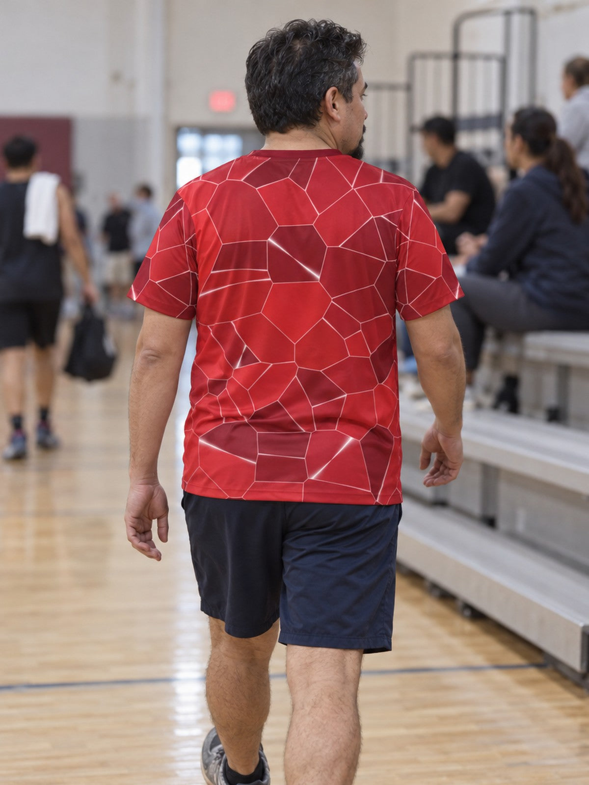 Man training in the Crimson Shatter men's sports jersey with the Vantacore V emblem on the left chest – back view