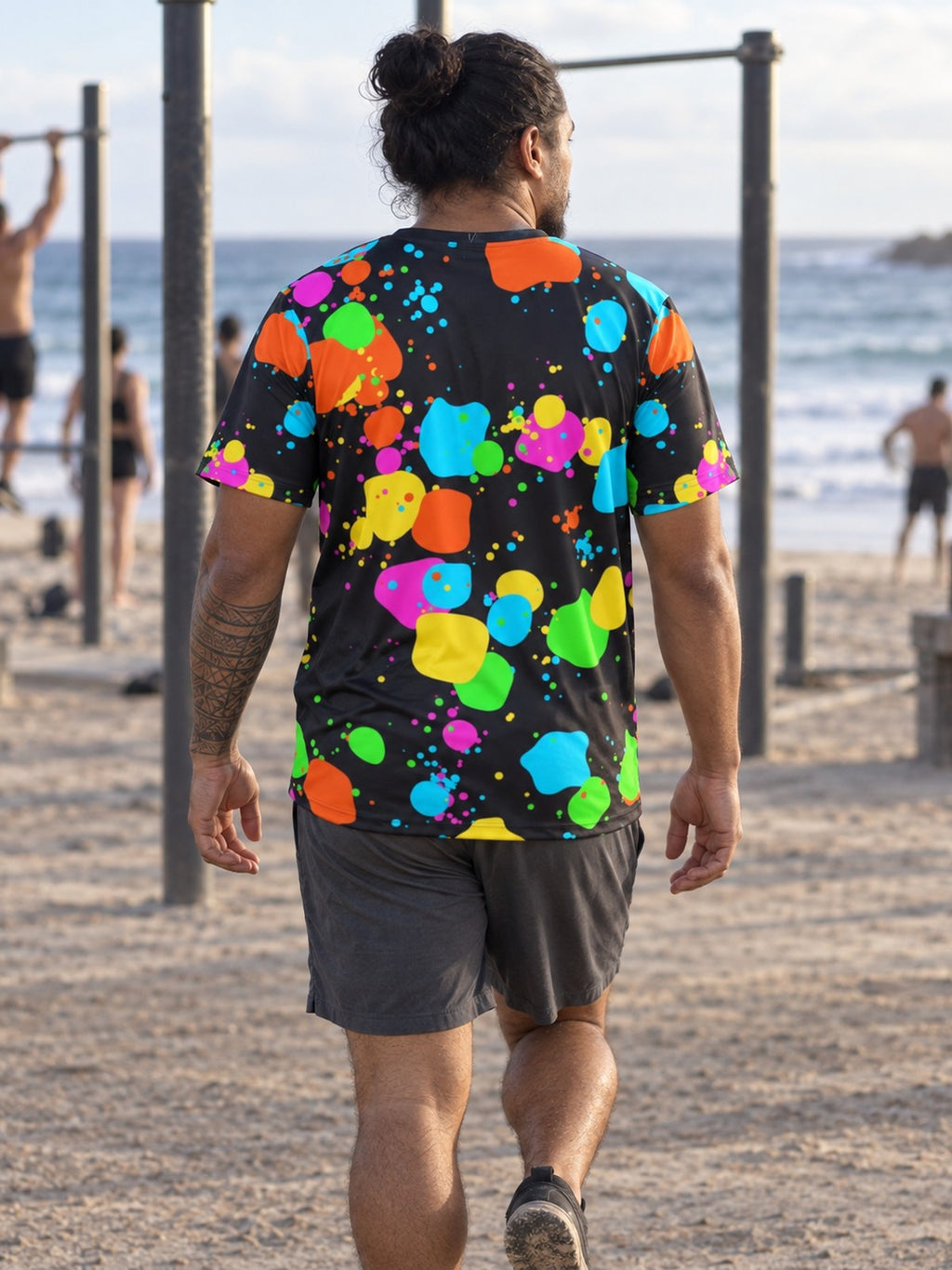 Man training in the Neon Splatter men's sports jersey with the Vantacore V emblem on the left chest – back view