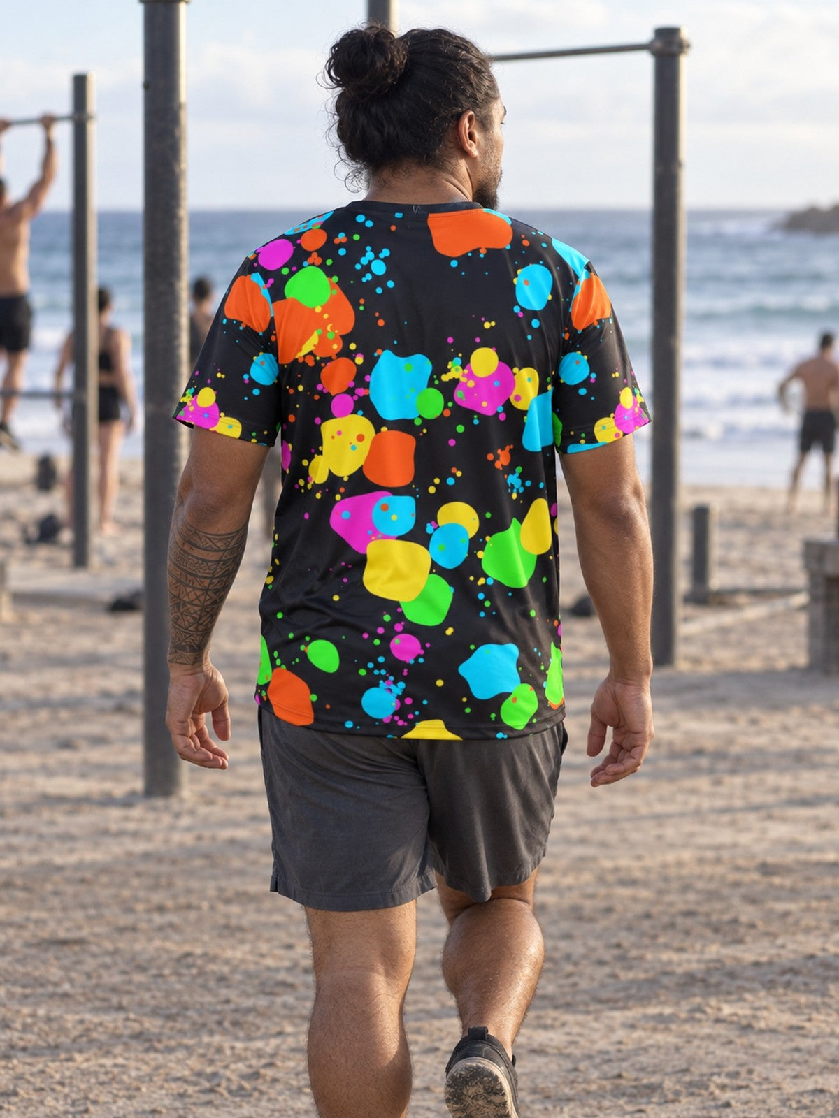 Man training in the Neon Splatter men's sports jersey with the Vantacore V emblem on the left chest – back view